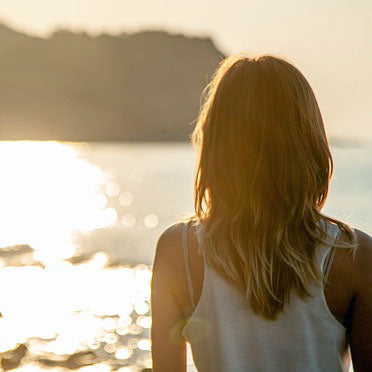 woman looking at ocean